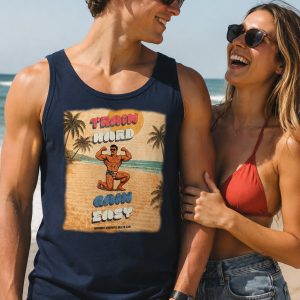 Man with girlfriend. He is wearing a tank top from Boondrift that reads "Train Hard, Gain Easy" in a retro gym like ad featuring a muscle bound, golden era bodybuilder.