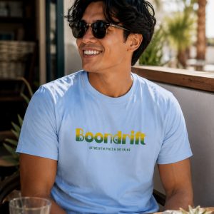 Man wearing 70's Coastal Heritage logo shirt from Boondrift.
