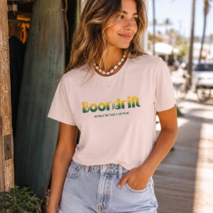 Beautiful woman wearing 70's Coastal Heritage logo shirt from Boondrift.