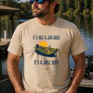 Blue collar man at lake waring It's not a Jon Boat It's a Jake Boat shirt from Boondrift.